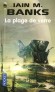 La plage de verre - Une traque rocambolesque, de planète en planète, conduit Sharrow vers les origines mystérieuses de sa lignée...  - Iain M. Banks -  Science Fiction - Iain m Banks